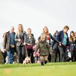 Family and friends walking their dogs at a Great British Dog Walk